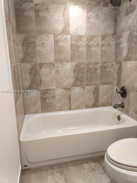 9001 Southwest 77th Avenue, Unit C604 Miami, FL 33156 - Photo 10 of 17 a bathroom with a bathtub and a toilet