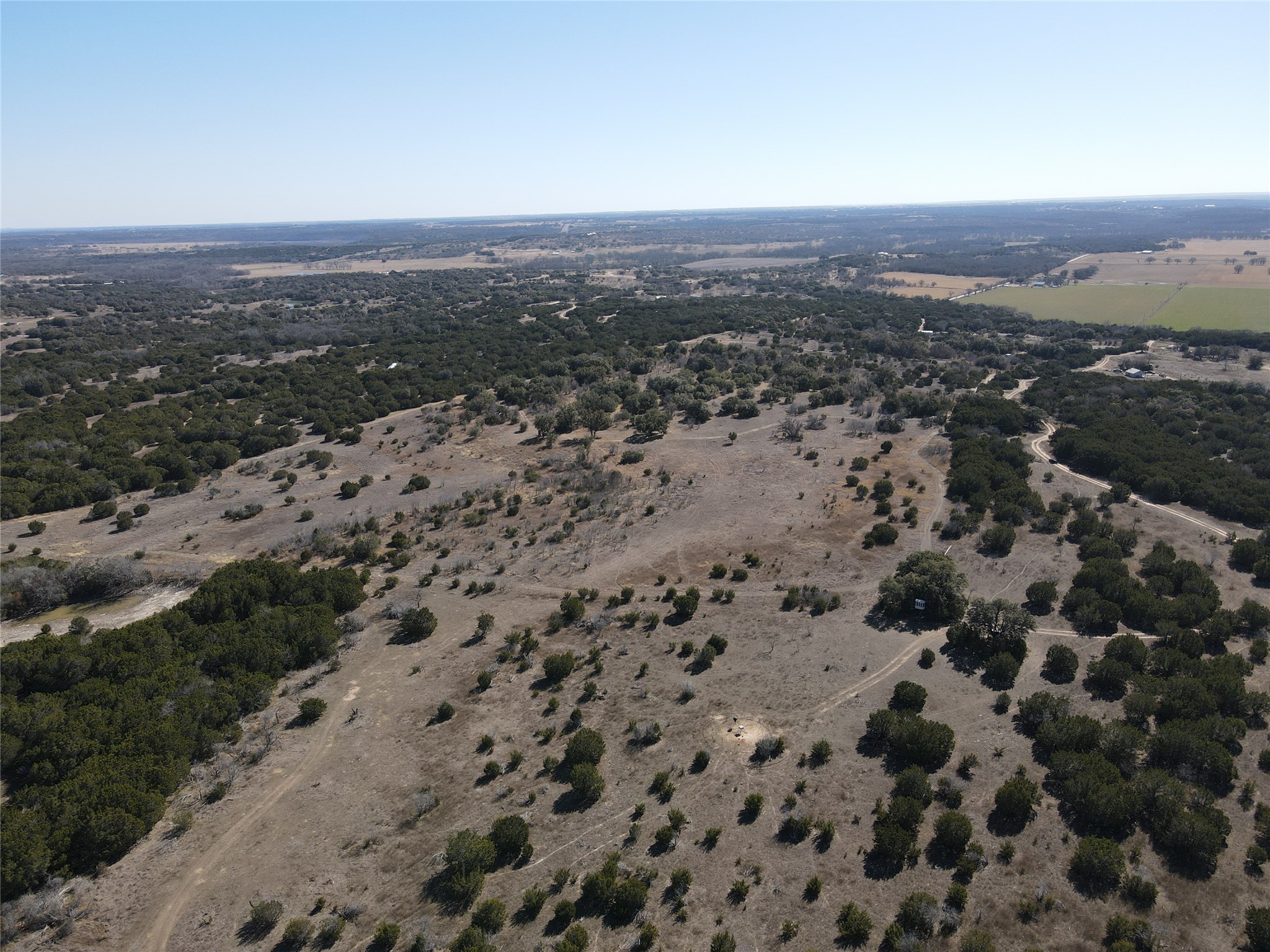 1 County Road 111 Hamilton, TX 76531 - Photo 17 of 32 an aerial view of house with yard and mountain view in back