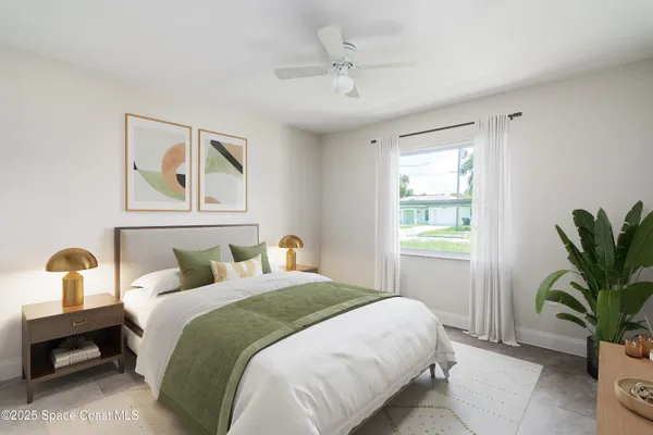 a bedroom with bed and window