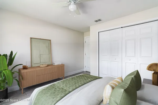 a bedroom with a bed and a couch