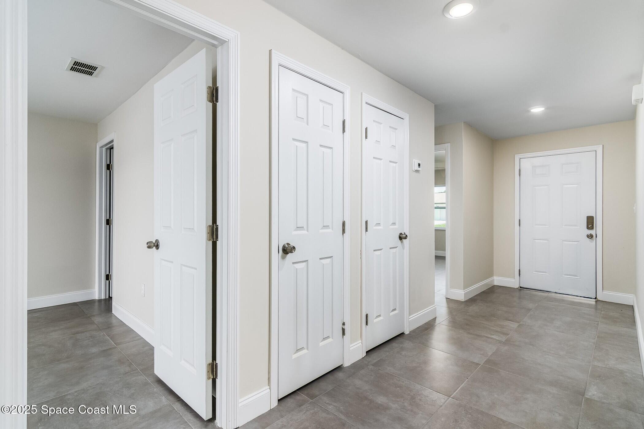 828 Angela Avenue, Unit A Rockledge, FL 32955 - Photo 20 of 31 a view of a hallway with closet area