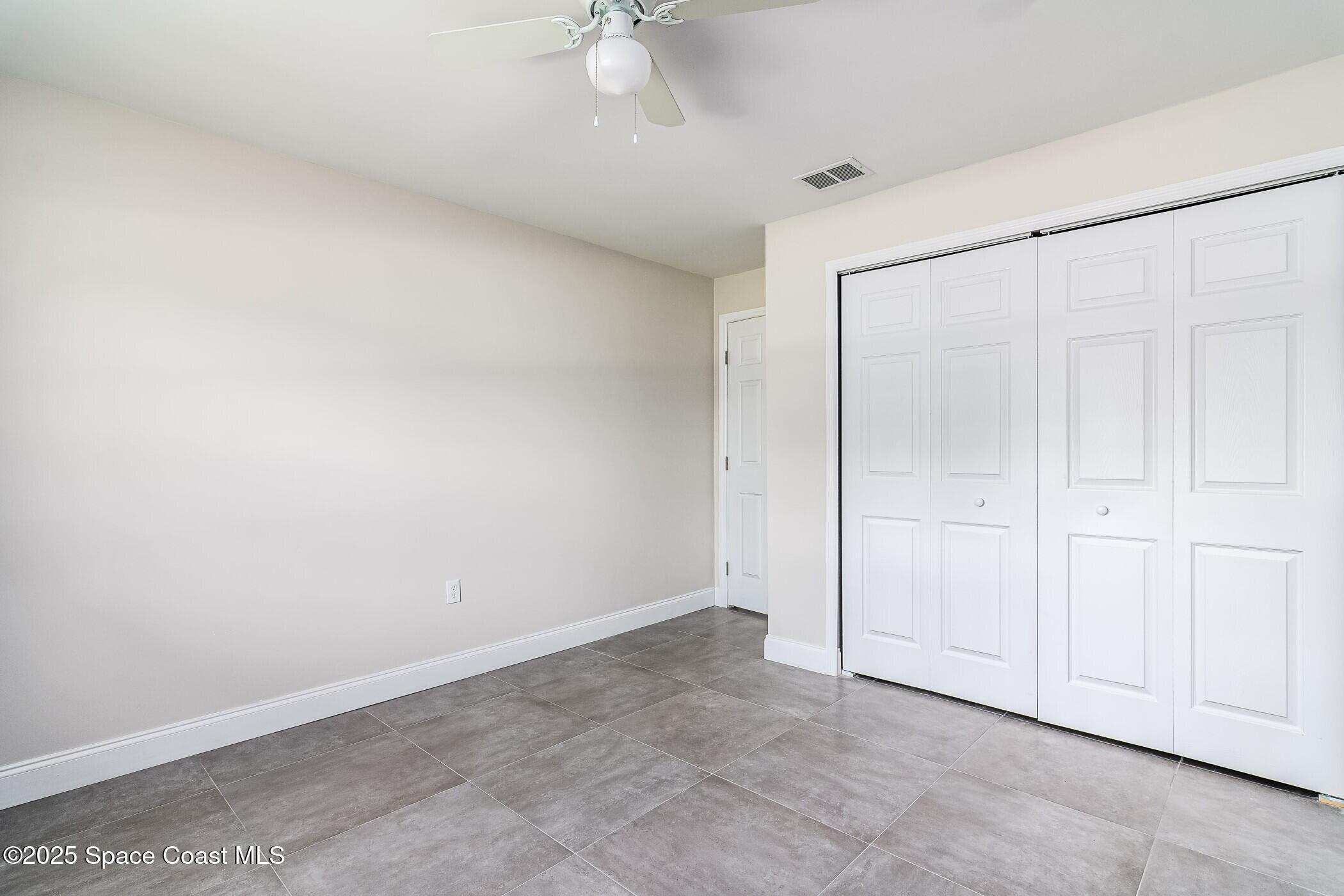 828 Angela Avenue, Unit A Rockledge, FL 32955 - Photo 23 of 31 an empty room with a empty space