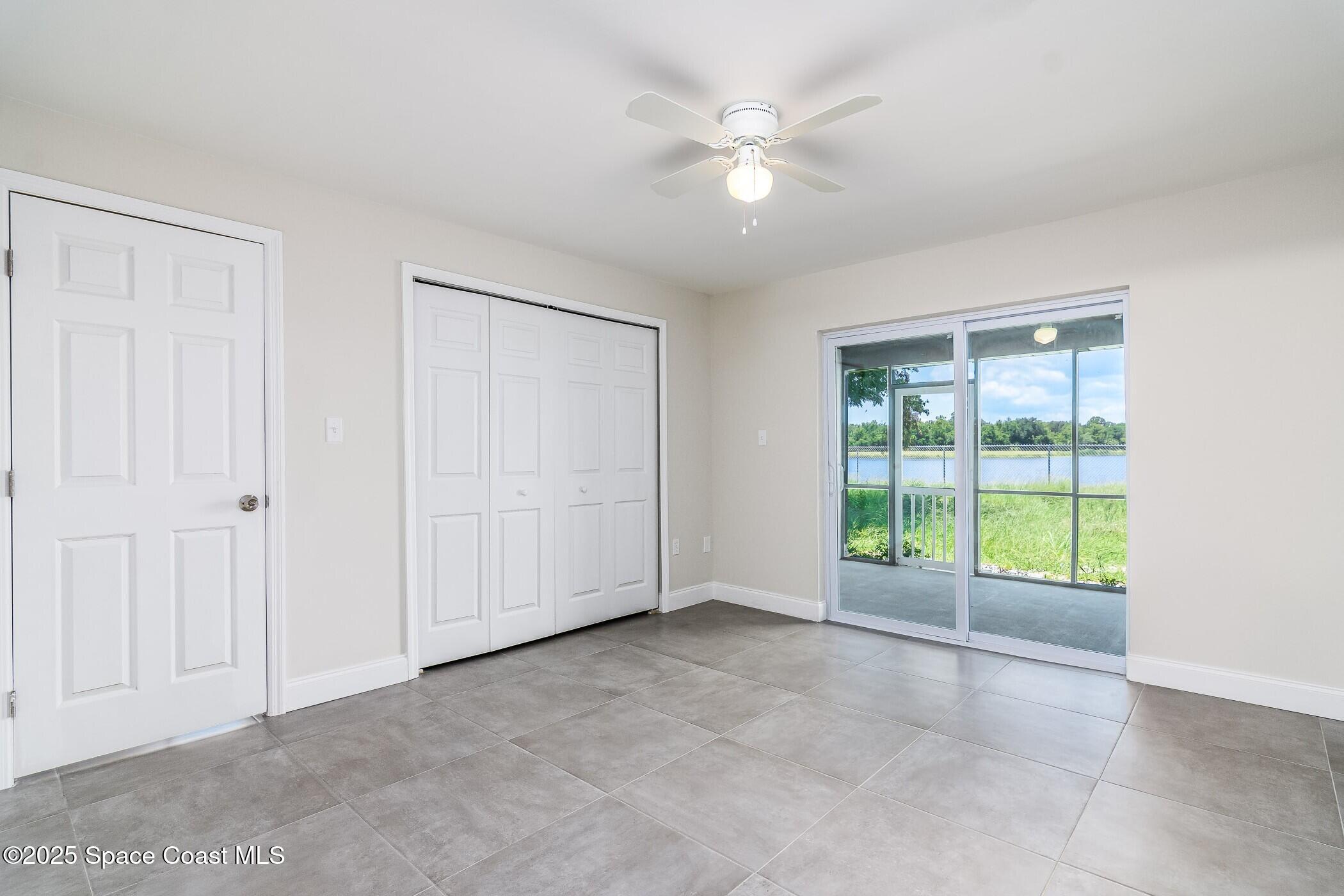 828 Angela Avenue, Unit A Rockledge, FL 32955 - Photo 29 of 31 a view of an empty room with a window