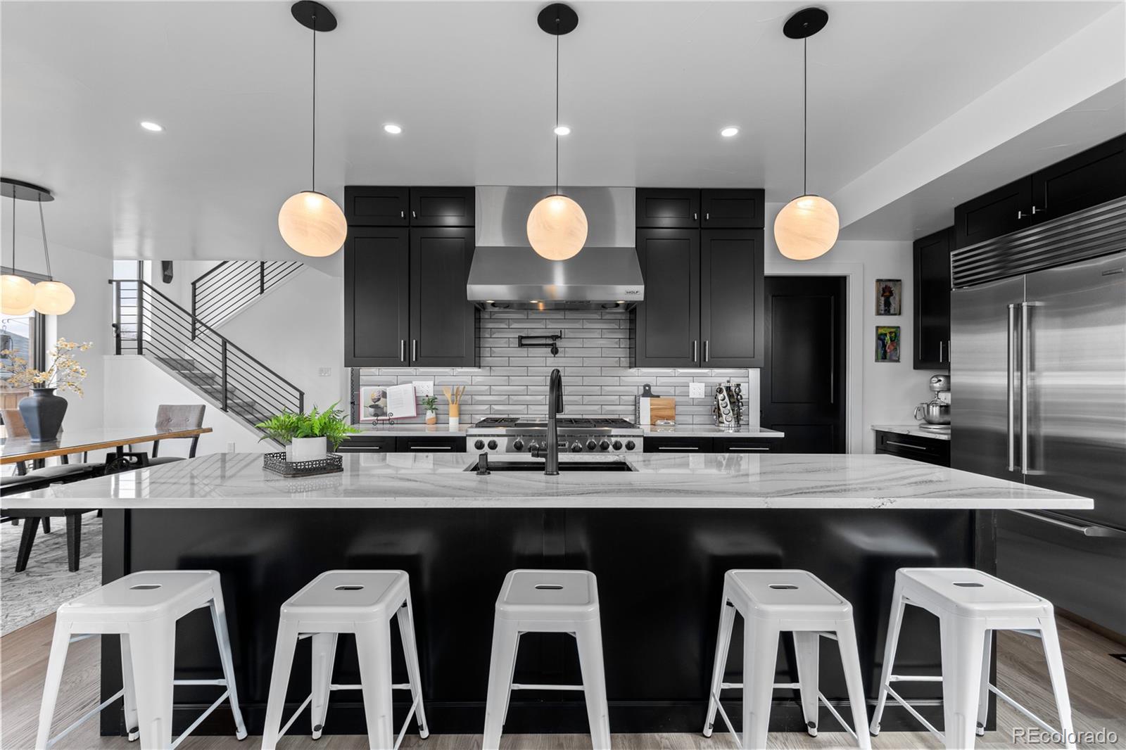 1655 Wolff Street Denver, CO 80204 - Photo 11 of 50 a kitchen with a table and chairs in it