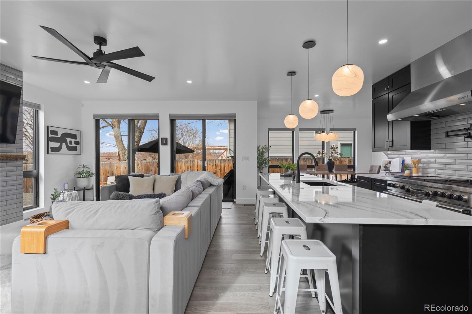 1655 Wolff Street Denver, CO 80204 - Photo 15 of 50 a large kitchen with a table and chairs