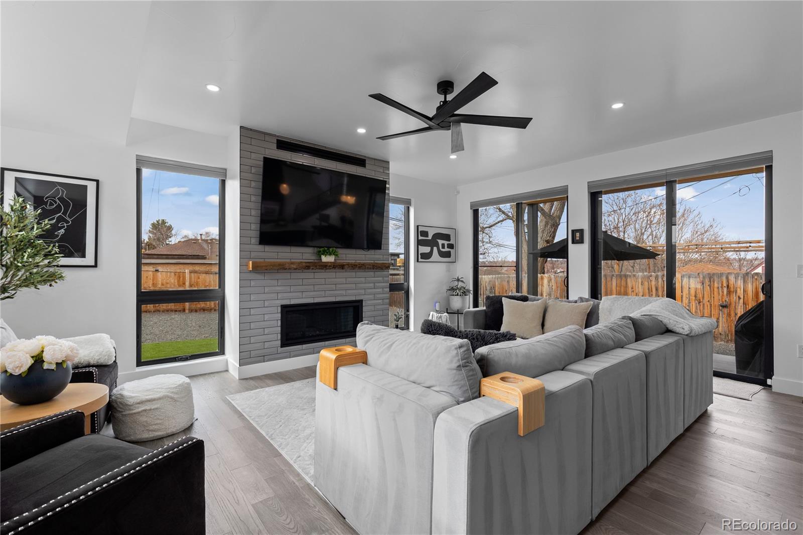1655 Wolff Street Denver, CO 80204 - Photo 16 of 50 a living room with fireplace furniture and a flat screen tv