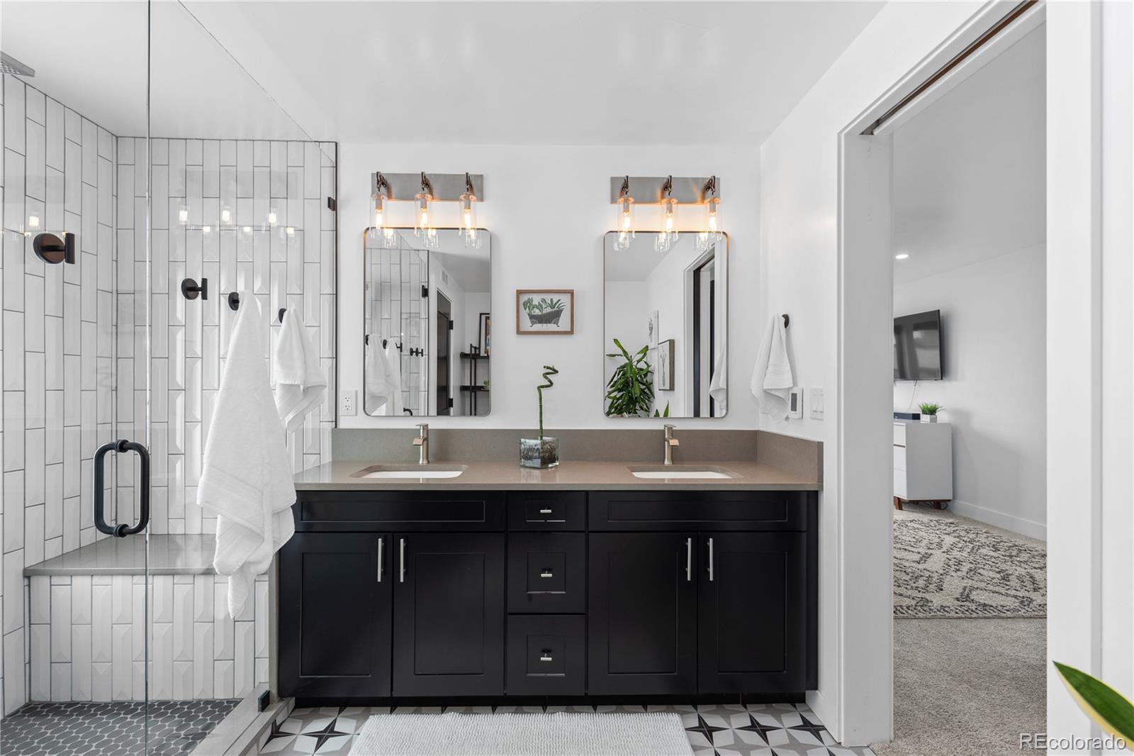 1655 Wolff Street Denver, CO 80204 - Photo 24 of 50 a bathroom with a sink double vanity and a mirror