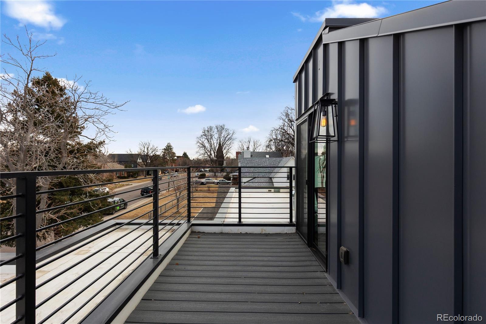 1655 Wolff Street Denver, CO 80204 - Photo 40 of 50 a view of a balcony with wooden floor and city view