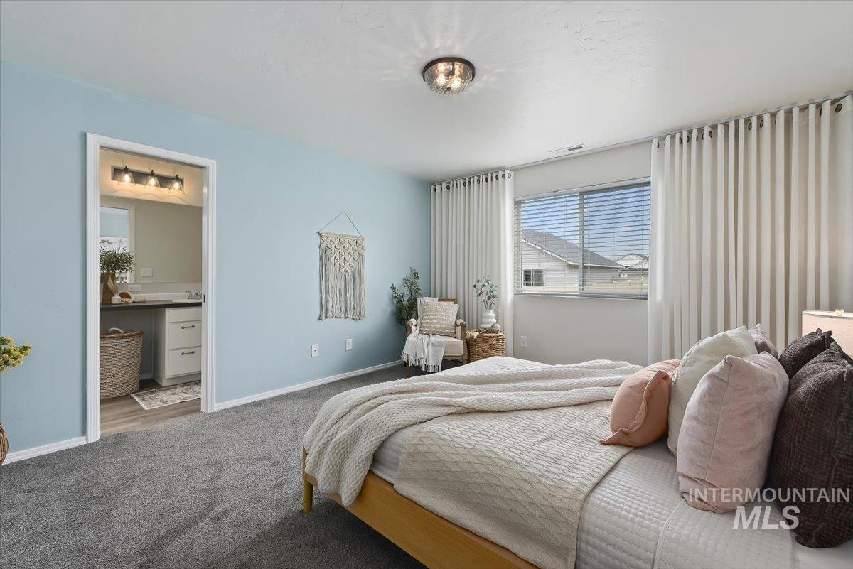 12781 Ashfield Street Caldwell, ID 83607 - Photo 19 of 36 Bedroom with carpet flooring and connected bathroom