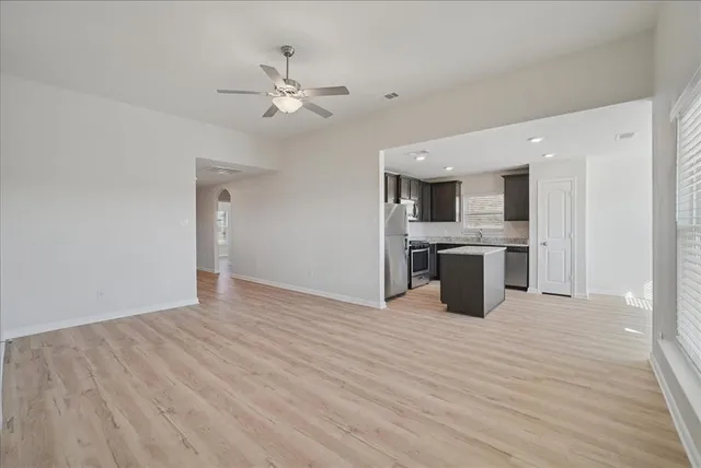 a view of kitchen with sink and wooden floor