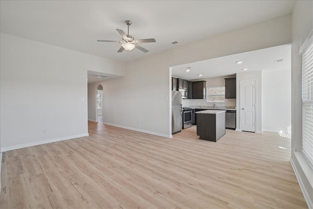 115 Sammy Fowler Avenue Venus, TX 76084 - Photo 14 of 34 a view of kitchen with sink and wooden floor