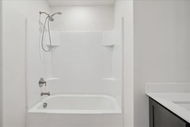 a bathroom with a bath tub and a shower