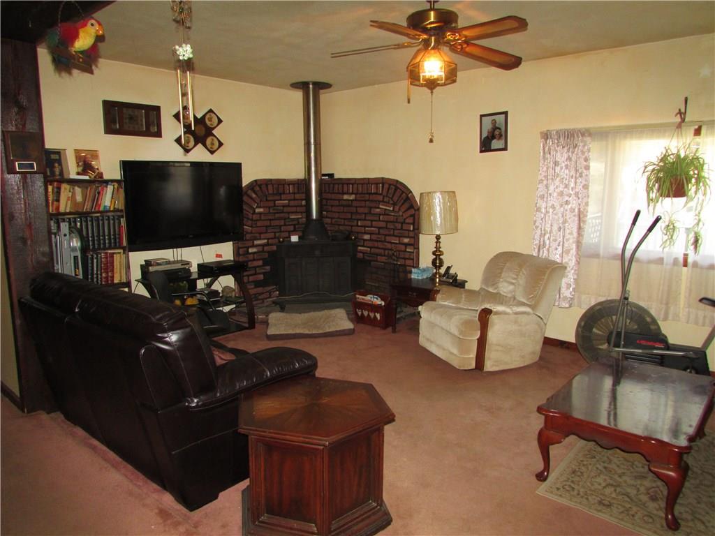 103 Platt Road Clinton, PA 15026 - Photo 7 of 14 LIVING ROOM WITH WOODBURNER.