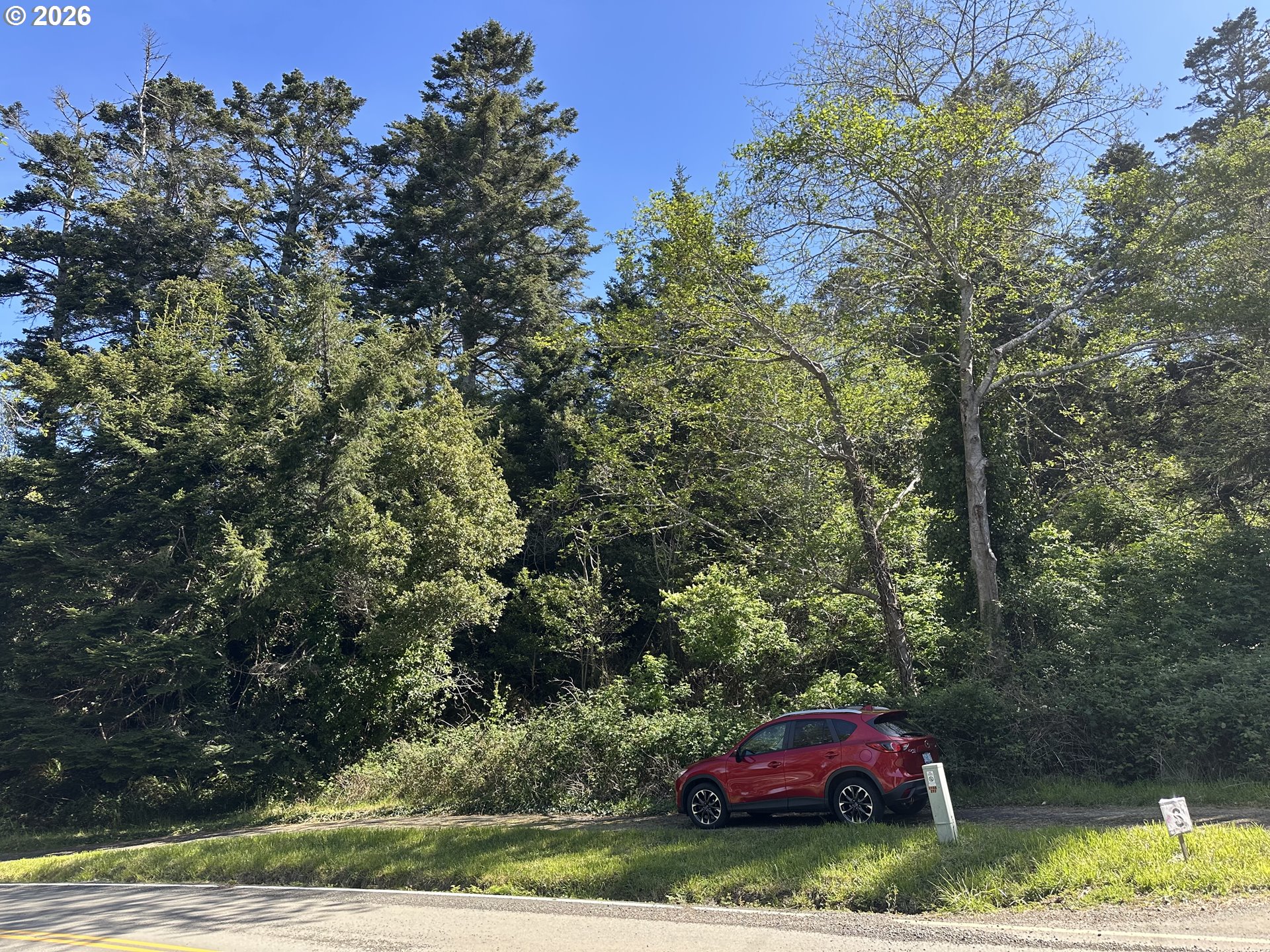 Hillside Acres Road Gold Beach, OR 97444 - Photo 2 of 5 a car parked on the side of the road