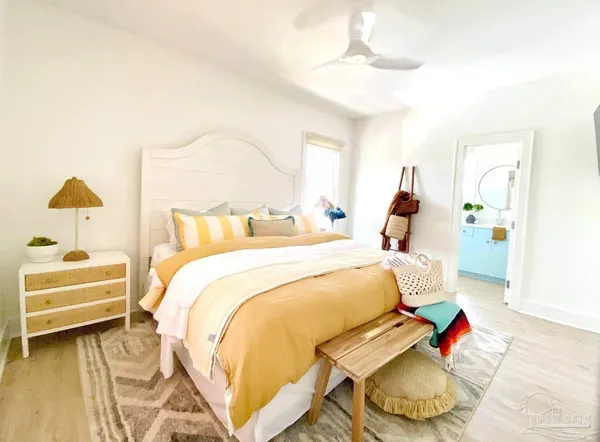 a bedroom with a bed and a television