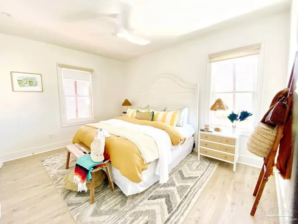 a bedroom with a bed and a mirror