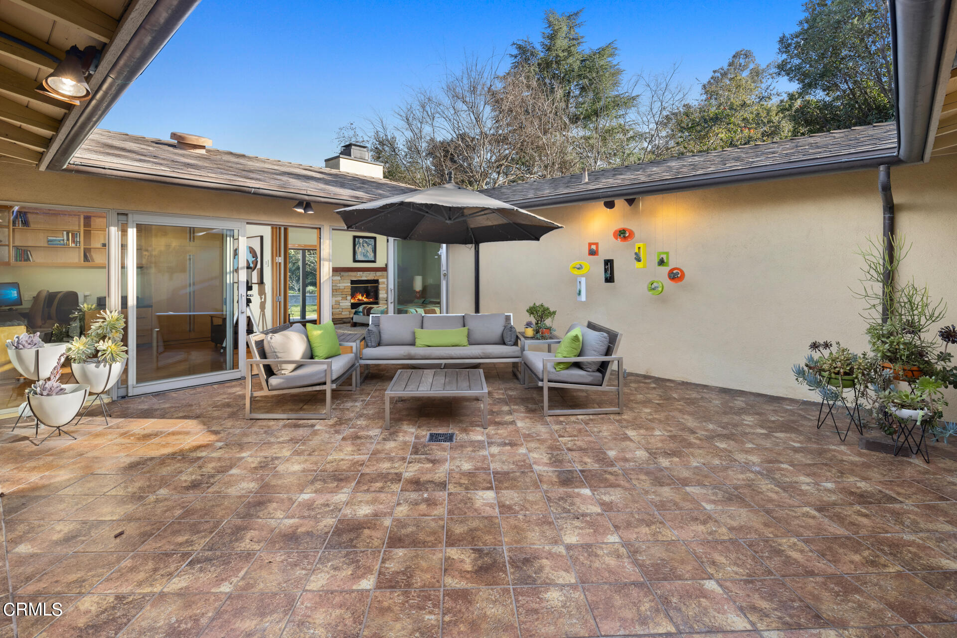 1470 Pegfair Estates Drive Pasadena, CA 91103 - Photo 14 of 48 a view of a patio with a table and chairs under an umbrella