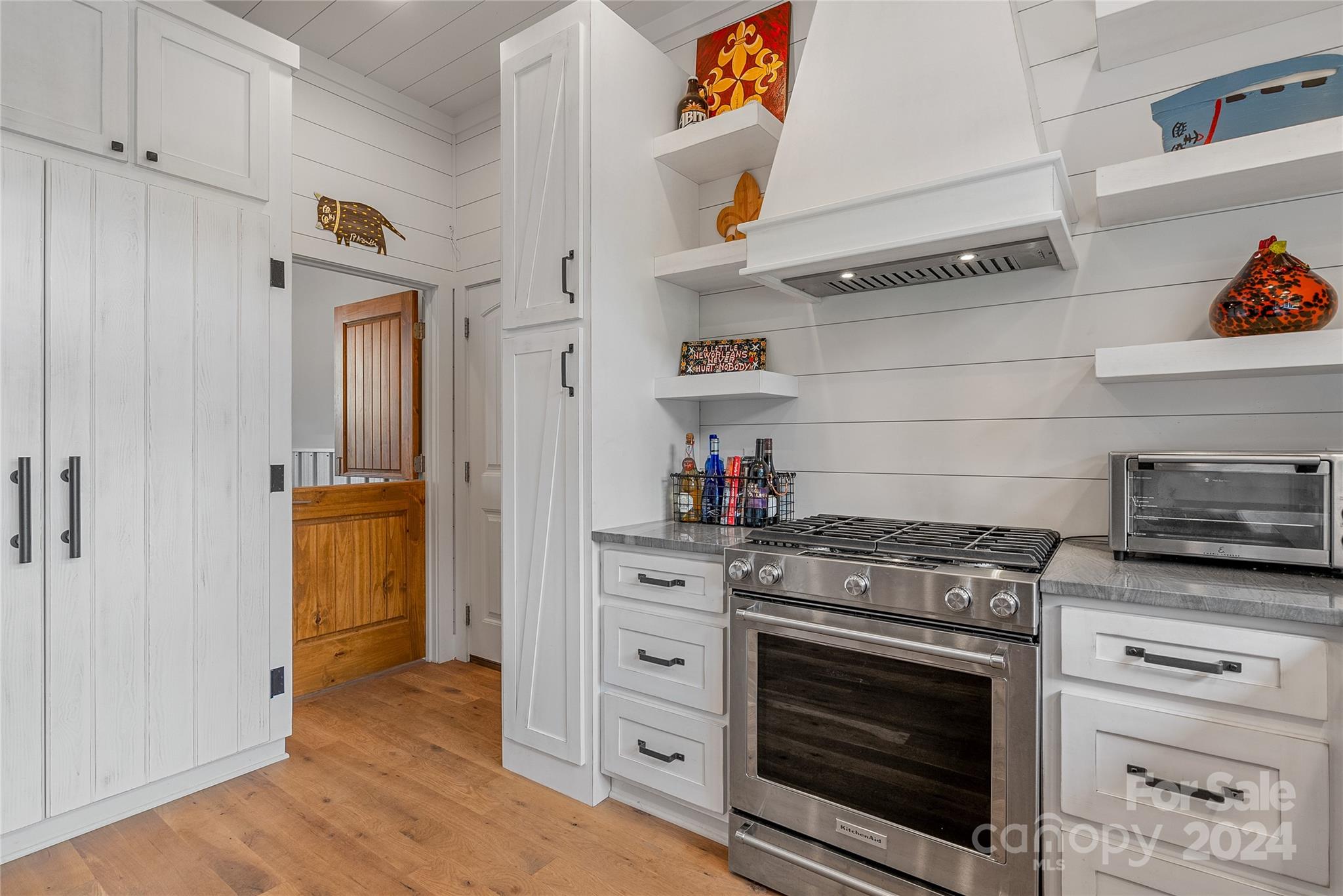 710 Tugaloo Road Landrum, SC 29356 - Photo 12 of 44 a kitchen with stainless steel appliances granite countertop a stove and a refrigerator