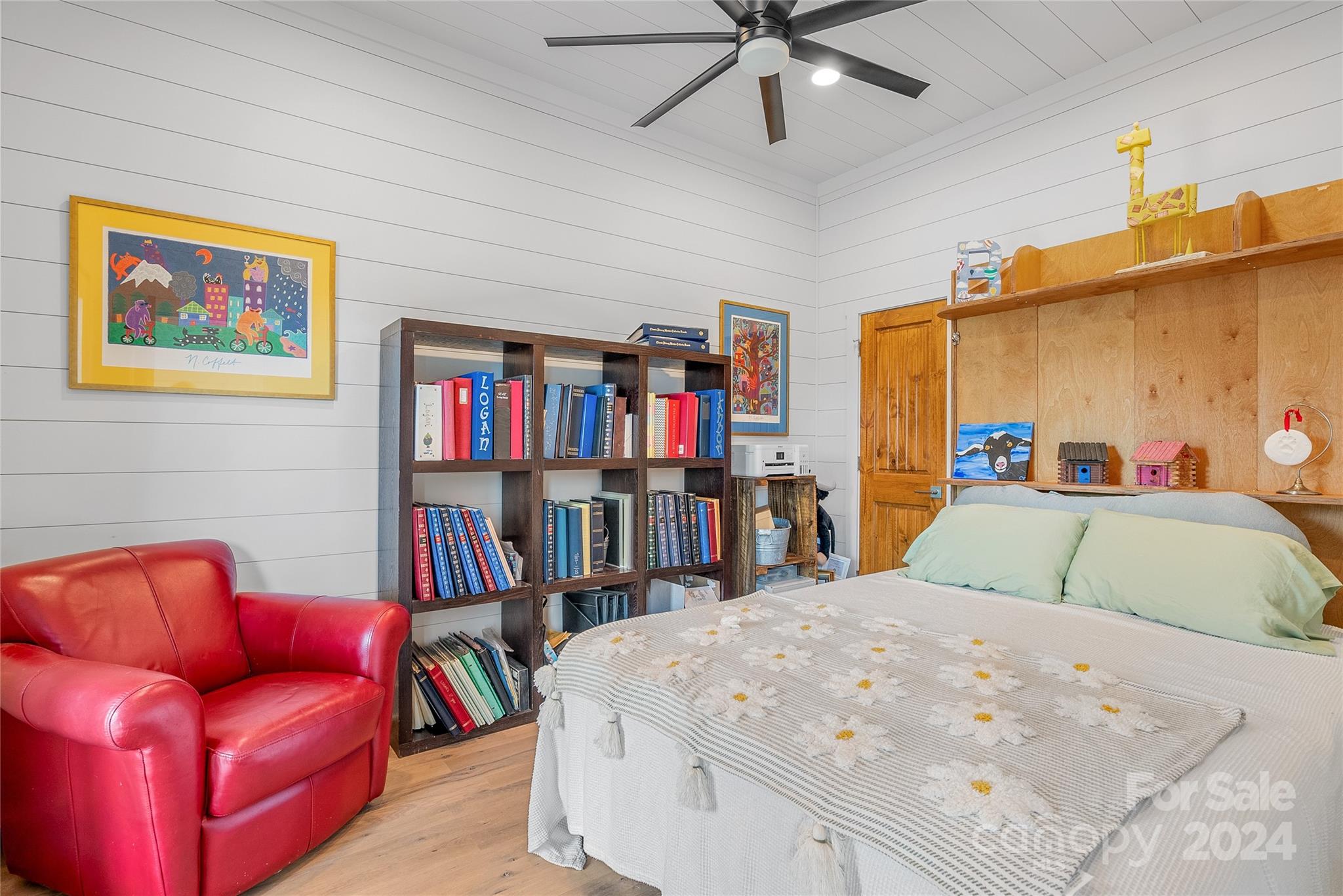 710 Tugaloo Road Landrum, SC 29356 - Photo 21 of 44 a bedroom with bed and a book shelf