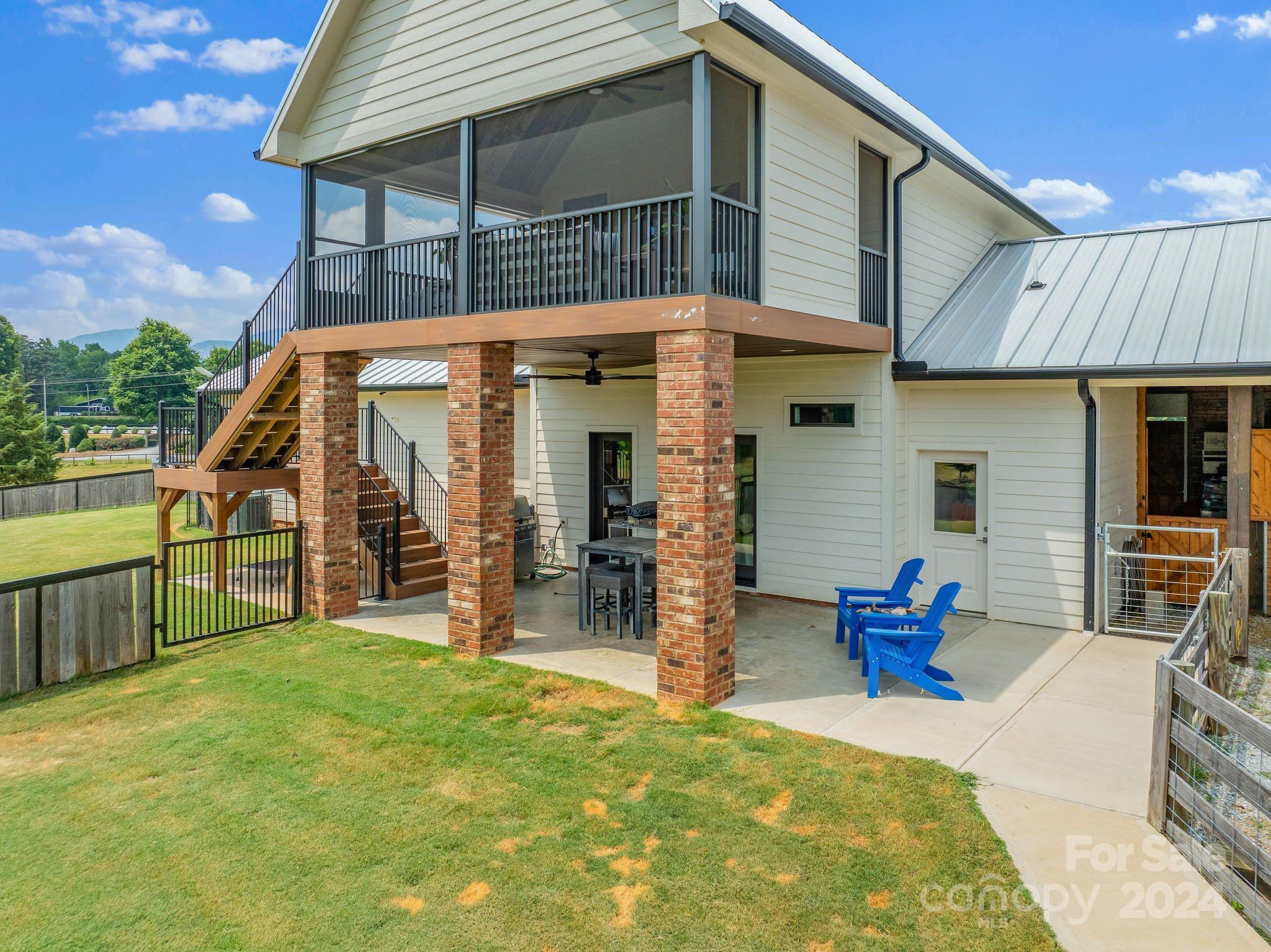 710 Tugaloo Road Landrum, SC 29356 - Photo 27 of 44 a view of a house with wooden deck and furniture