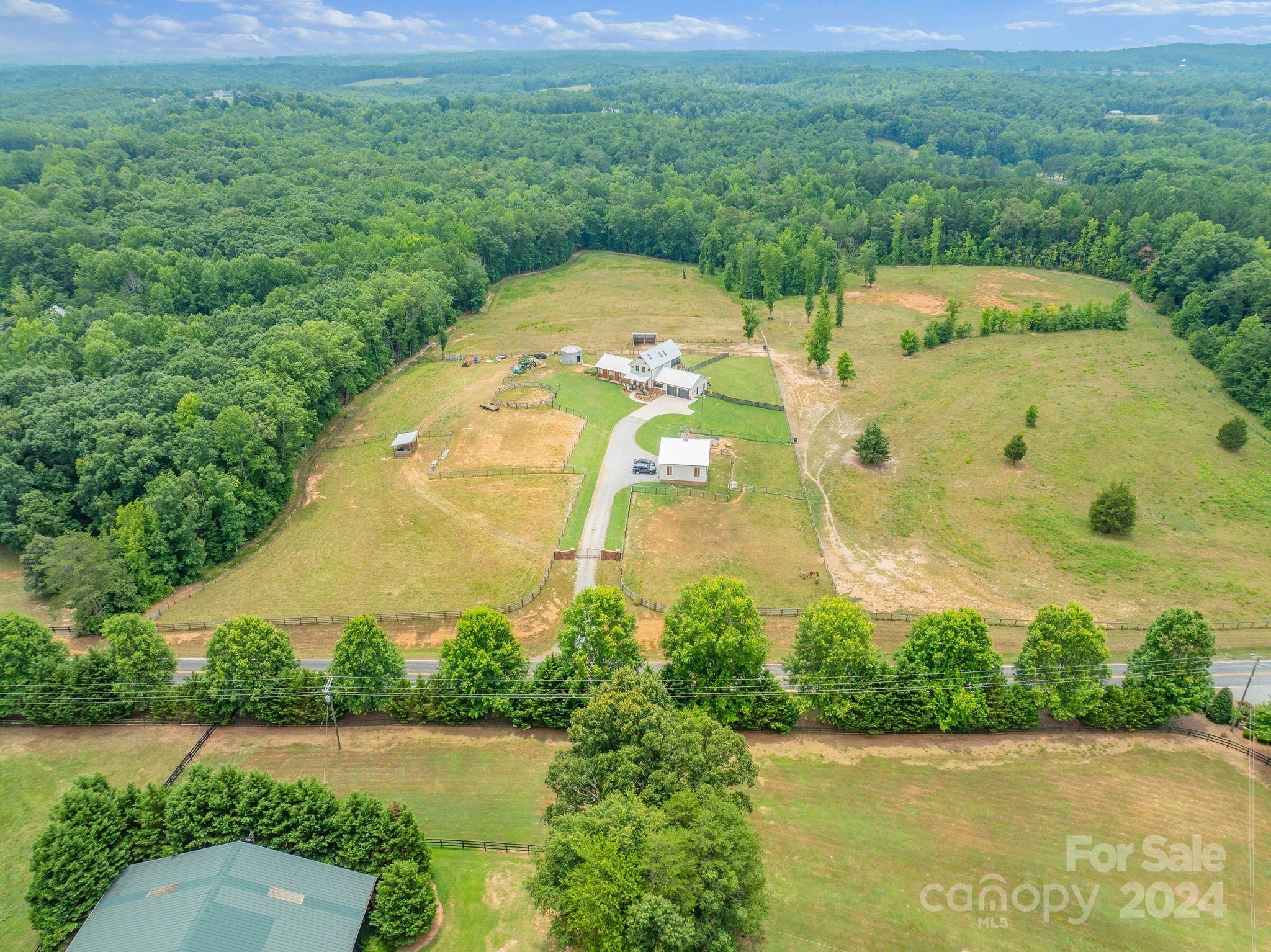 710 Tugaloo Road Landrum, SC 29356 - Photo 6 of 44 an aerial view of a house with a yard and lake view