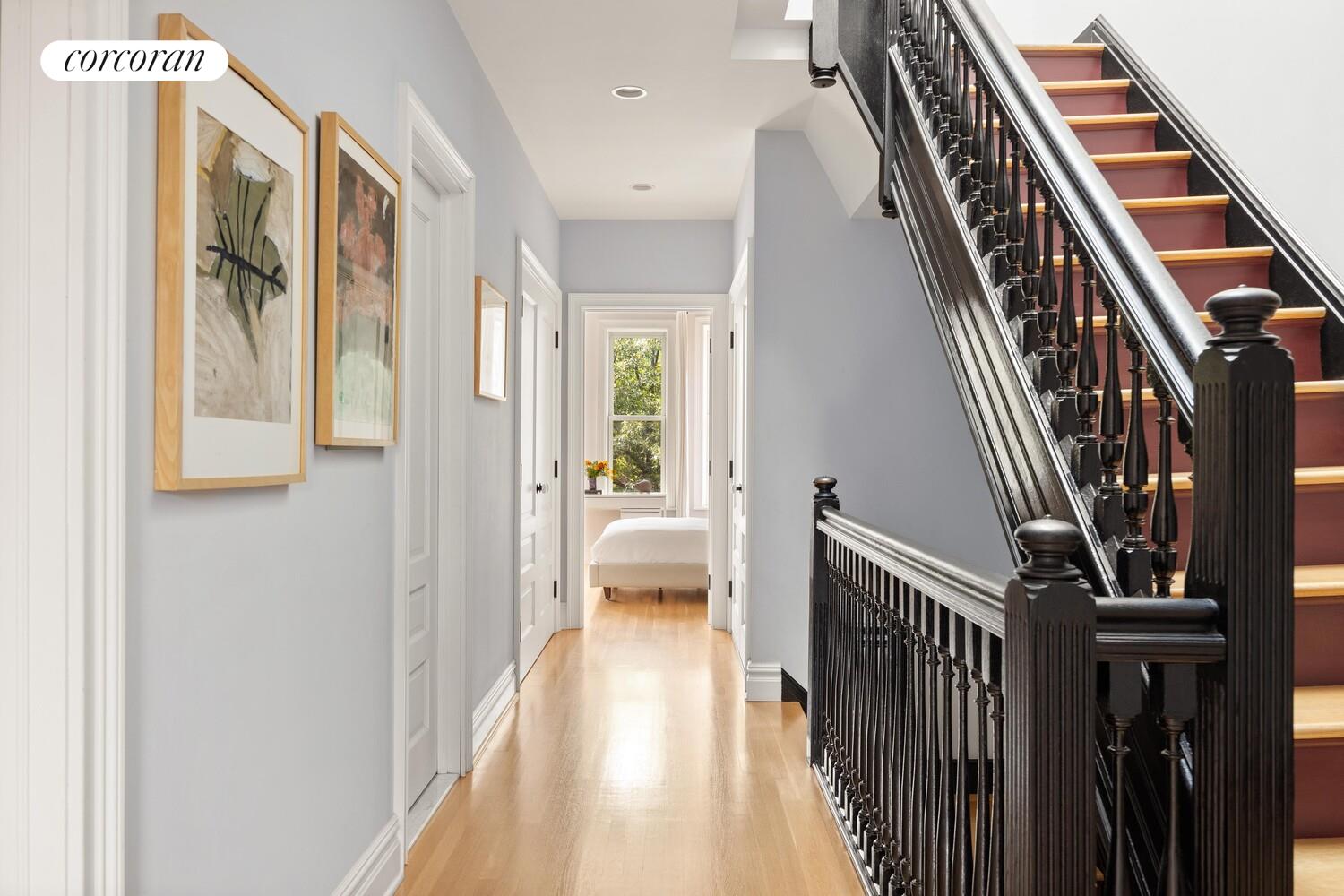291 Clinton Avenue Brooklyn, NY 11205 - Photo 20 of 34 a view of a hallway with wooden floor and staircase