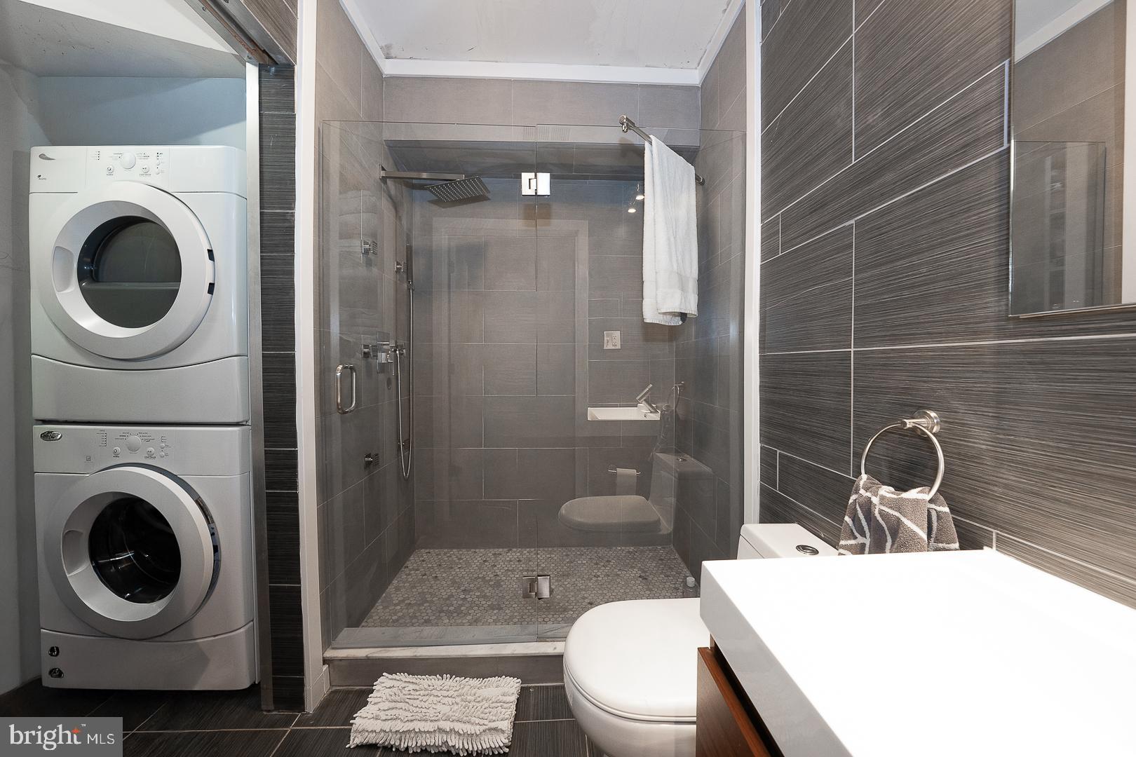 715 Shirley Street, Unit A Philadelphia, PA 19130 - Photo 17 of 24 a bathroom with a sink a toilet and shower