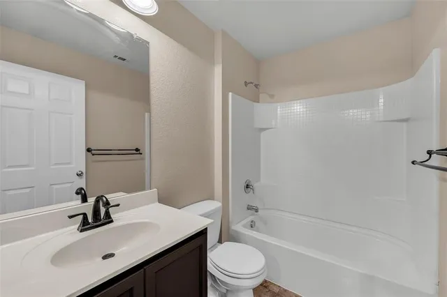 a bathroom with a sink toilet tub and shower