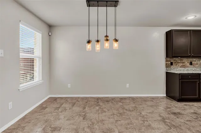 a view of a kitchen with a sink and a window