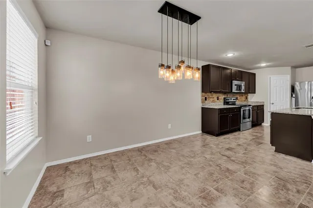 a view of kitchen with microwave and stove