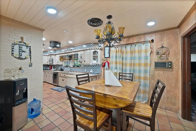 a dining room with furniture and window