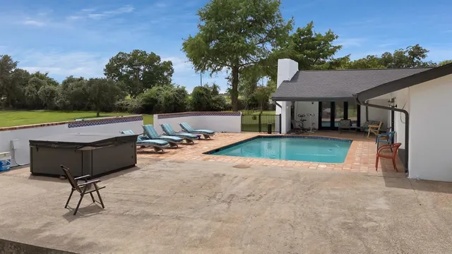 a view of a patio with a yard