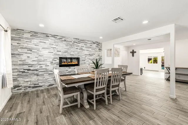 a kitchen with cabinets appliances a sink and a window