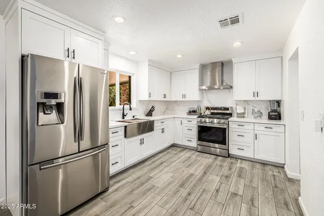 a spacious bedroom with a large bed and a large window