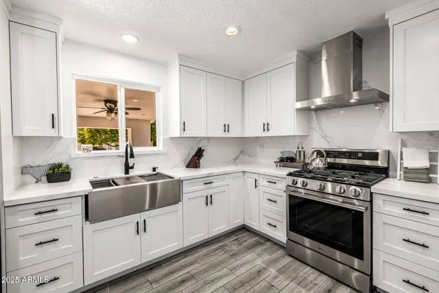 a large bedroom with a large bed and a large window