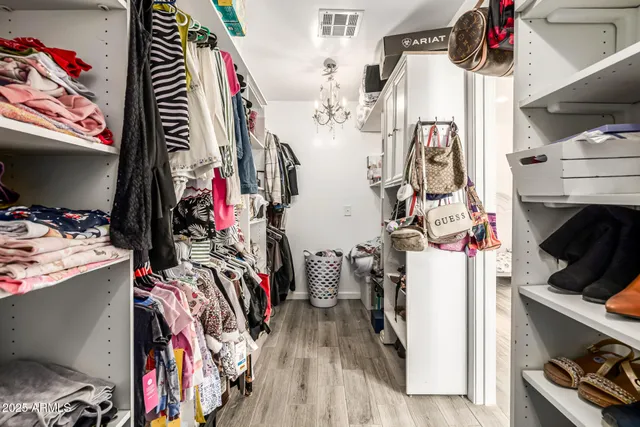 a bedroom with a bed and a walk in closet