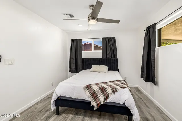 a bathroom with a shower and a sink