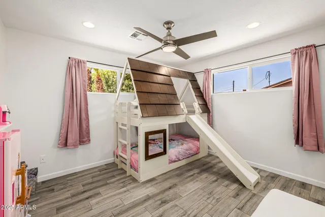 a view of a backyard with plants and patio