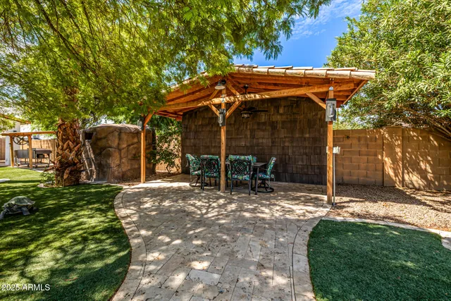 a dining room with furniture and a floor to ceiling window