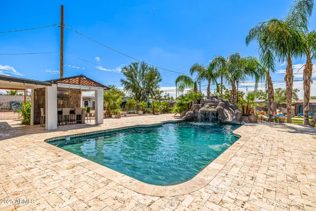 a swimming pool with barbeque oven