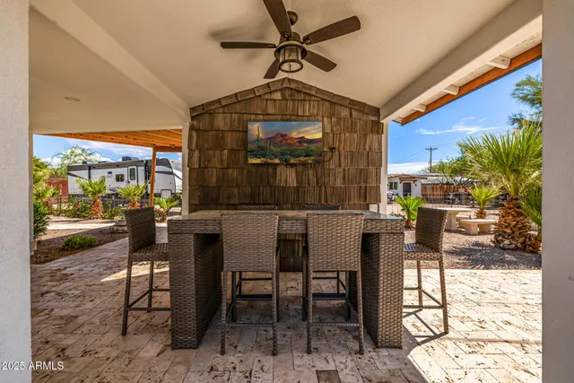 a front view of a house with a garden and yard