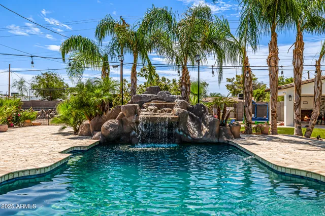 an aerial view of a house with a ocean view