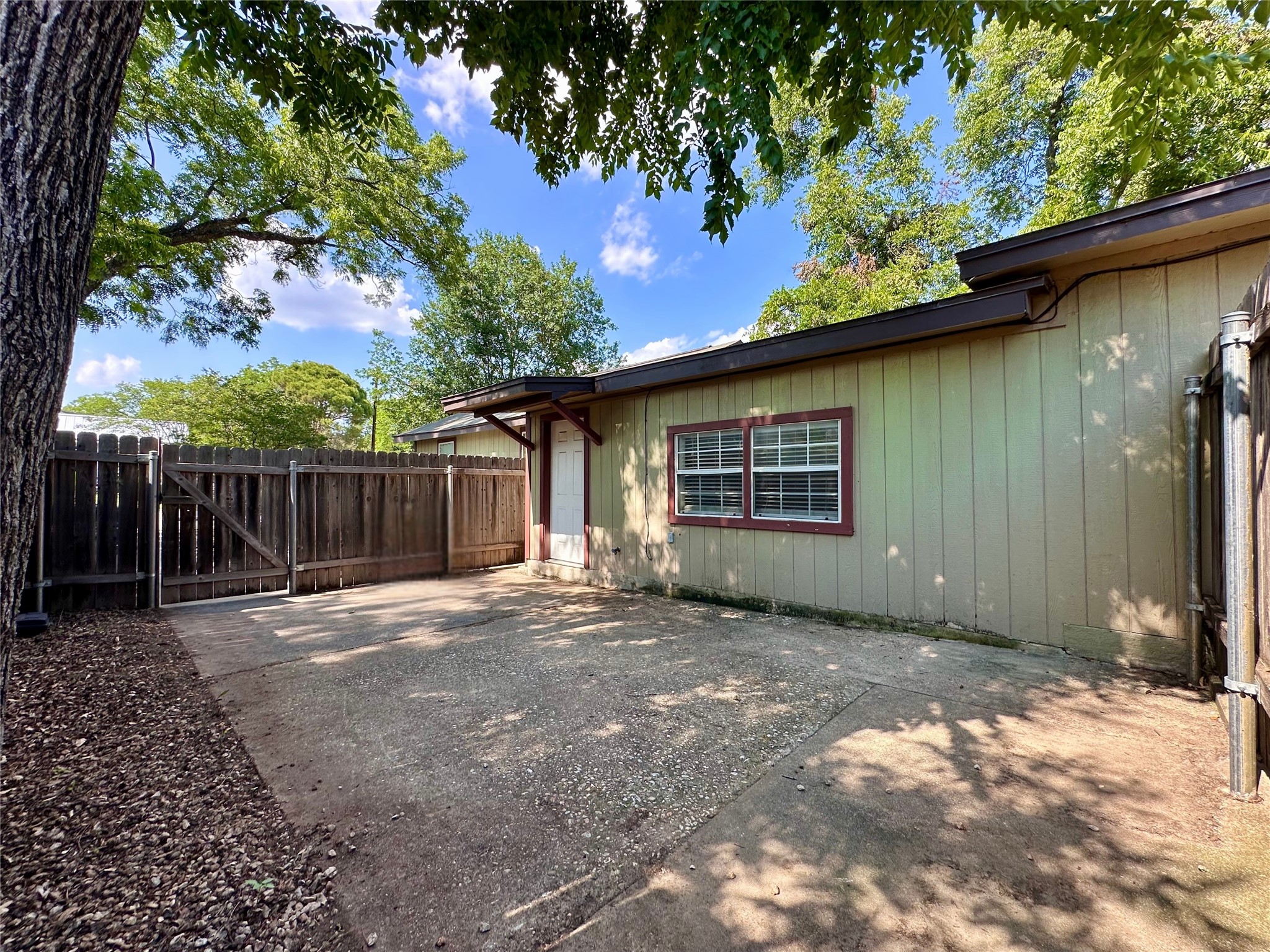 2103 East 16th Street, Unit ANNEX Austin, TX 78702 - Photo 18 of 23 a front view of a house with a garden