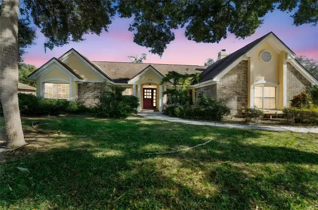 a view of a dining room with furniture a chandelier and wooden floor