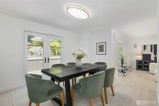 a dining room with furniture and window