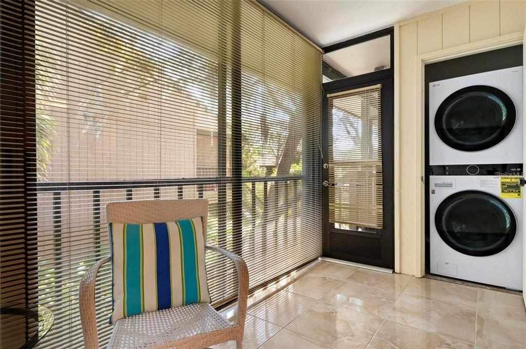 1707 Pelican Cove Road, Unit 451 Sarasota, FL 34231 - Photo 17 of 24 a view of a hallway with washer and dryer