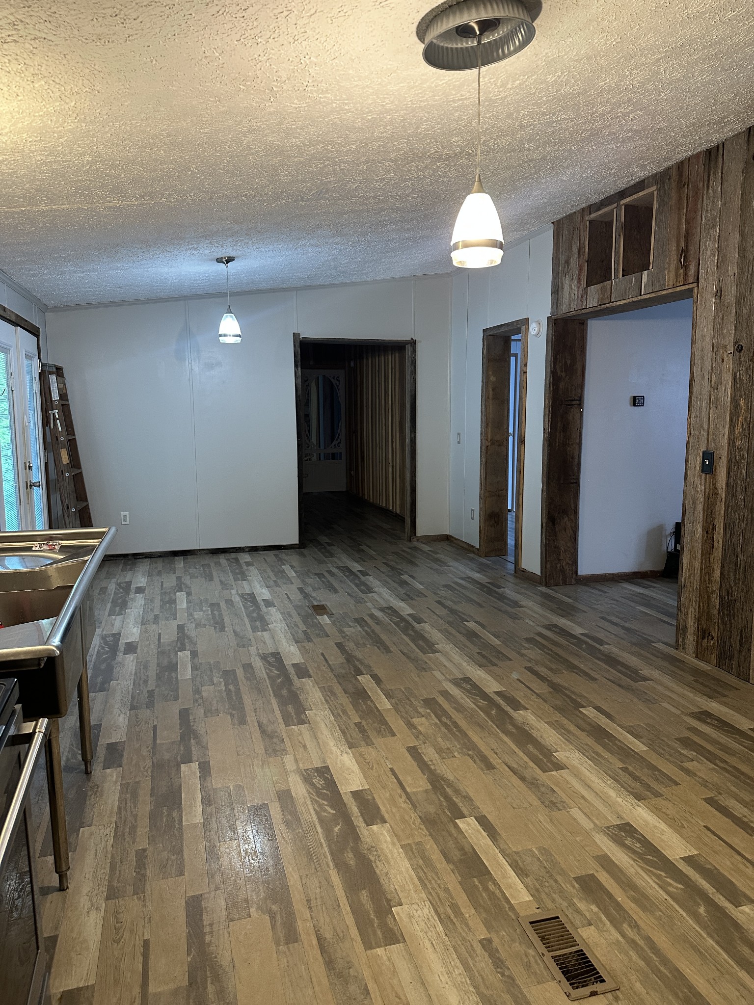 104 Limo View Lane Hohenwald, TN 38462 - Photo 13 of 67 a view of a livingroom with a chandelier