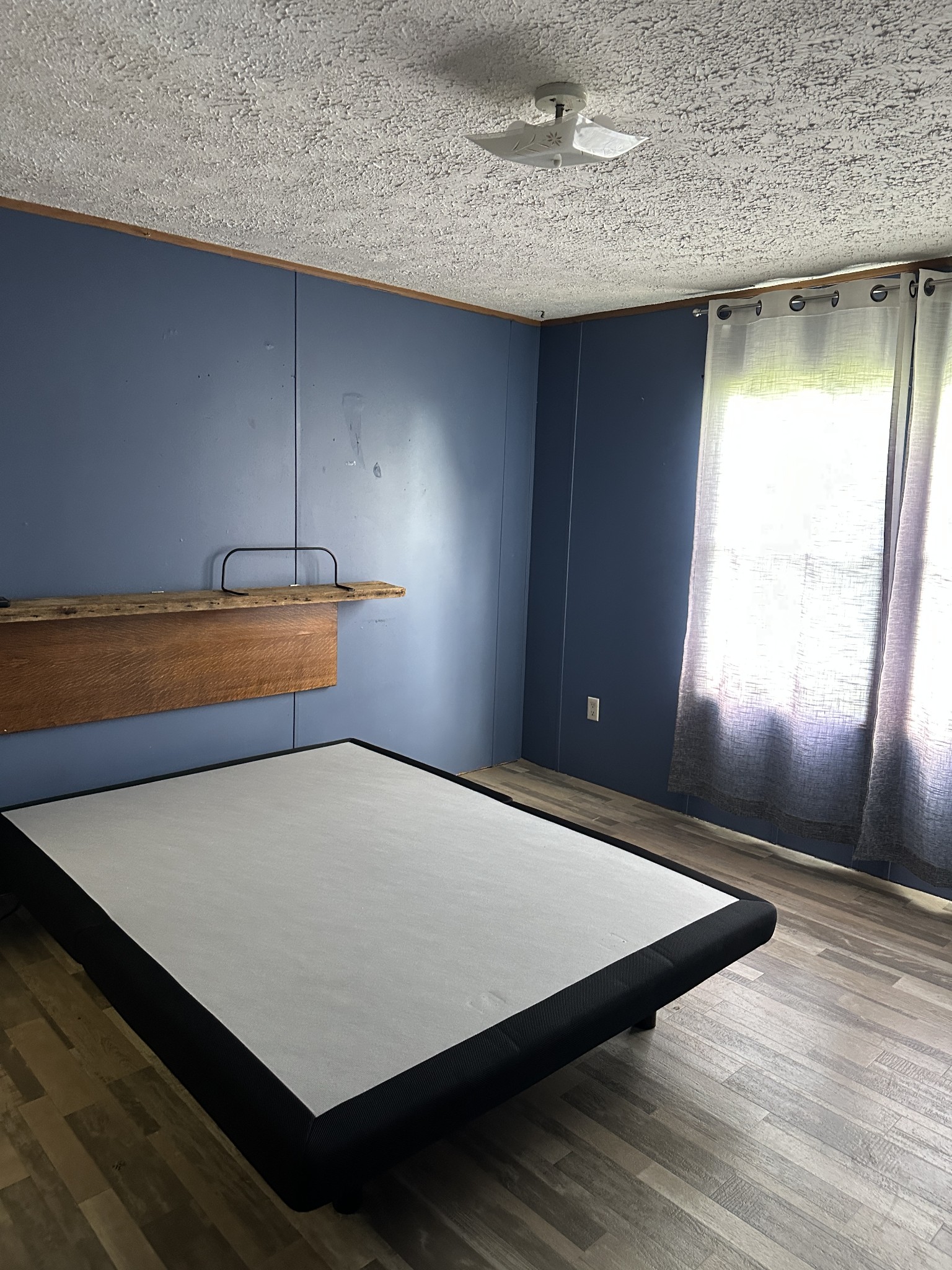 104 Limo View Lane Hohenwald, TN 38462 - Photo 32 of 67 a room with wooden floor and window