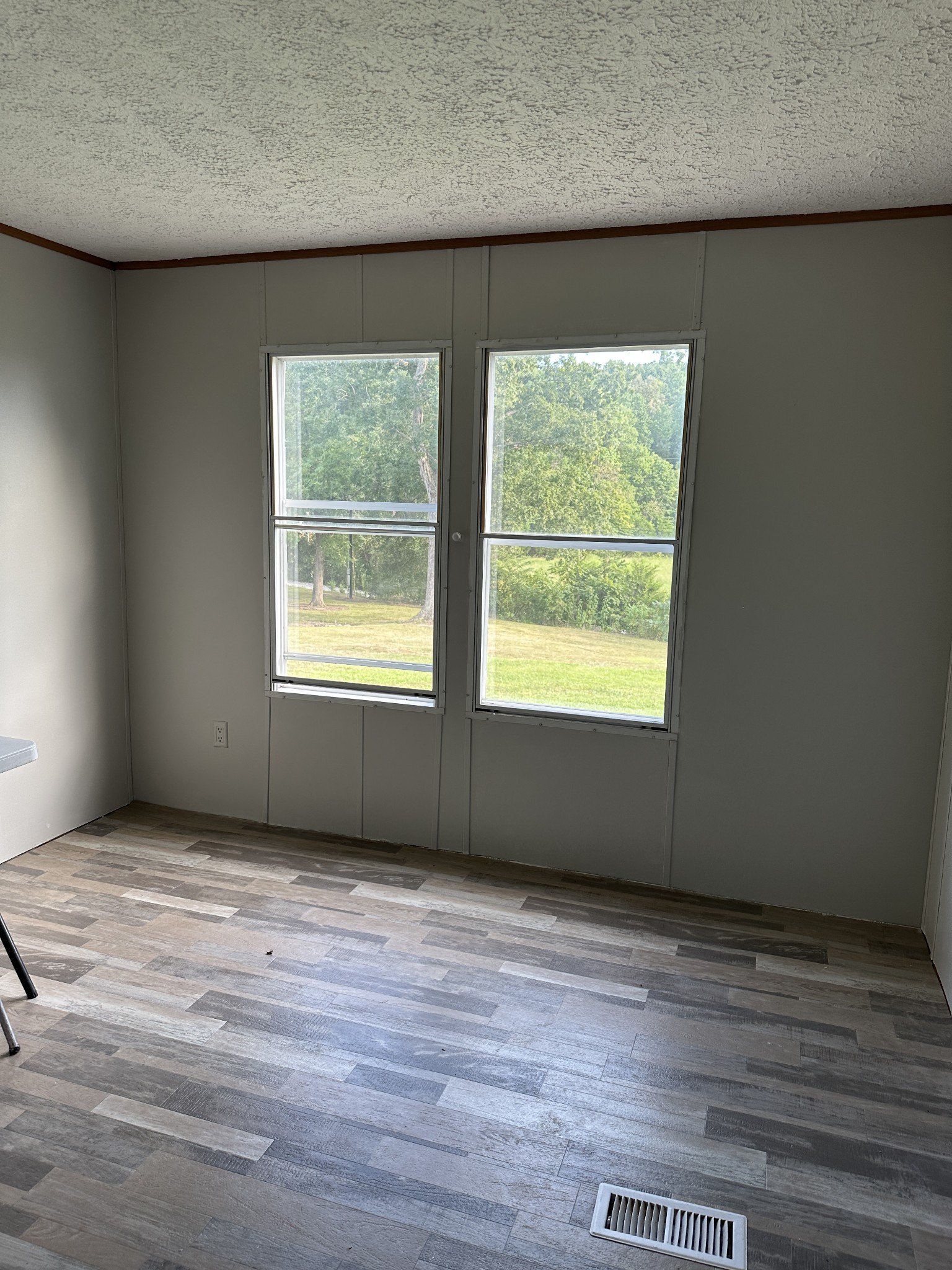 104 Limo View Lane Hohenwald, TN 38462 - Photo 36 of 67 a view of an empty room with wooden floor and a window