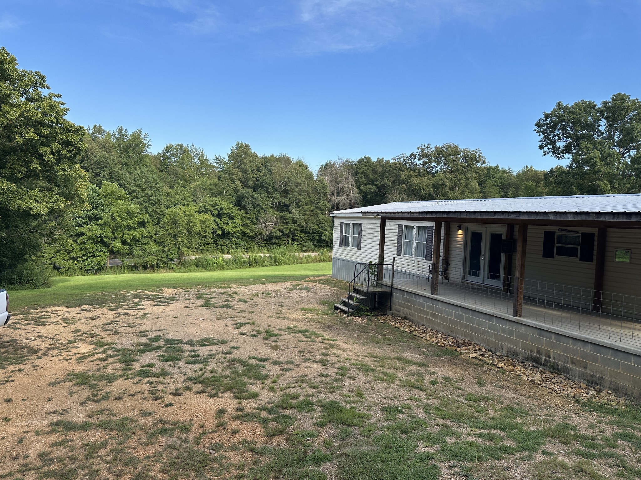 104 Limo View Lane Hohenwald, TN 38462 - Photo 5 of 67 a view of a house with a yard